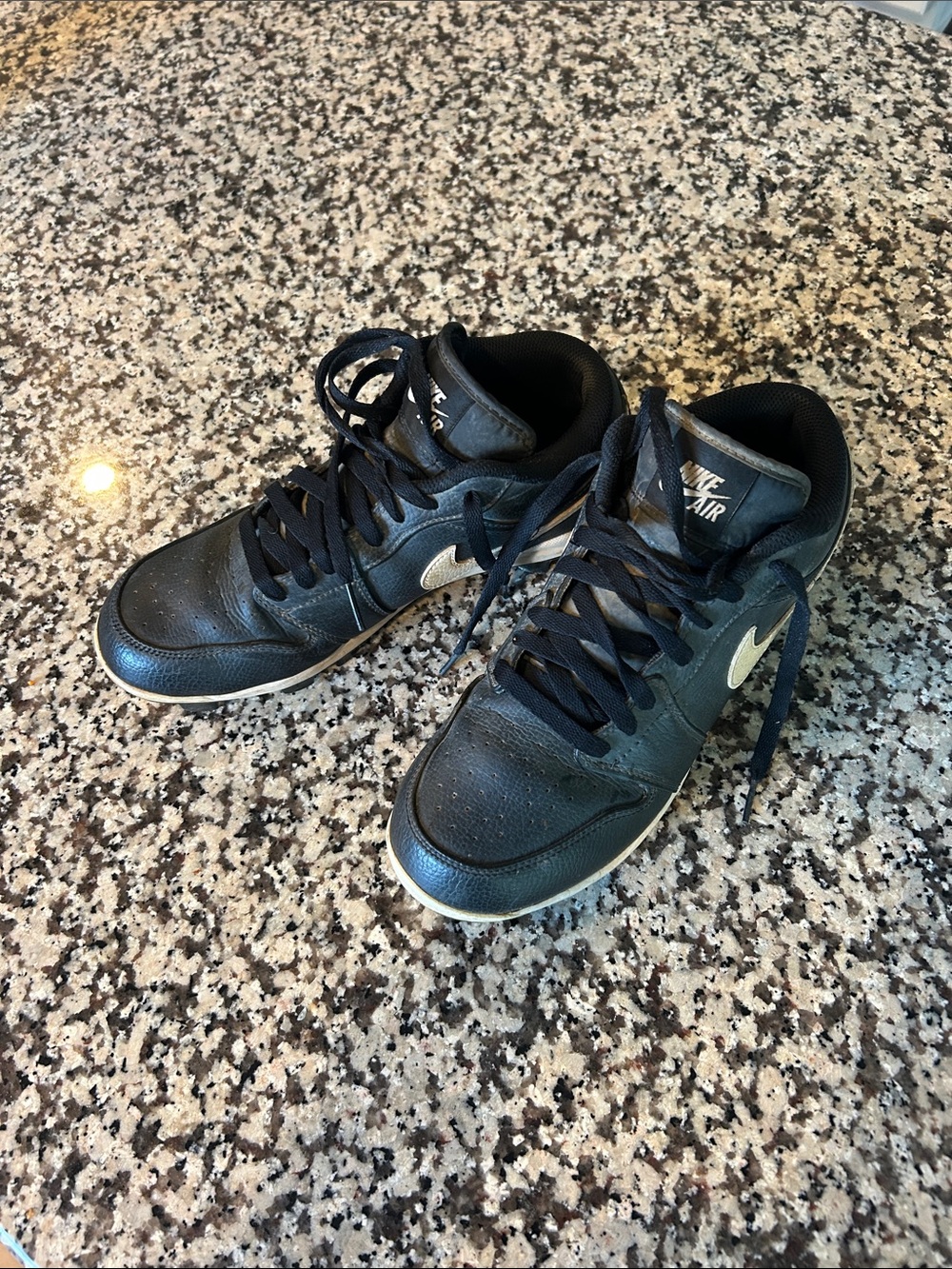 Nike Black jordan cleats with White Swoosh